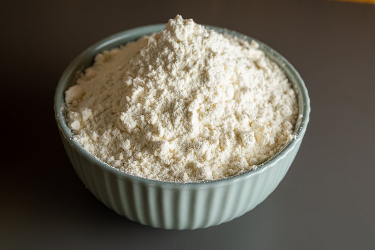 Close-up of a bowl filled with flour, perfect for culinary and baking themes.